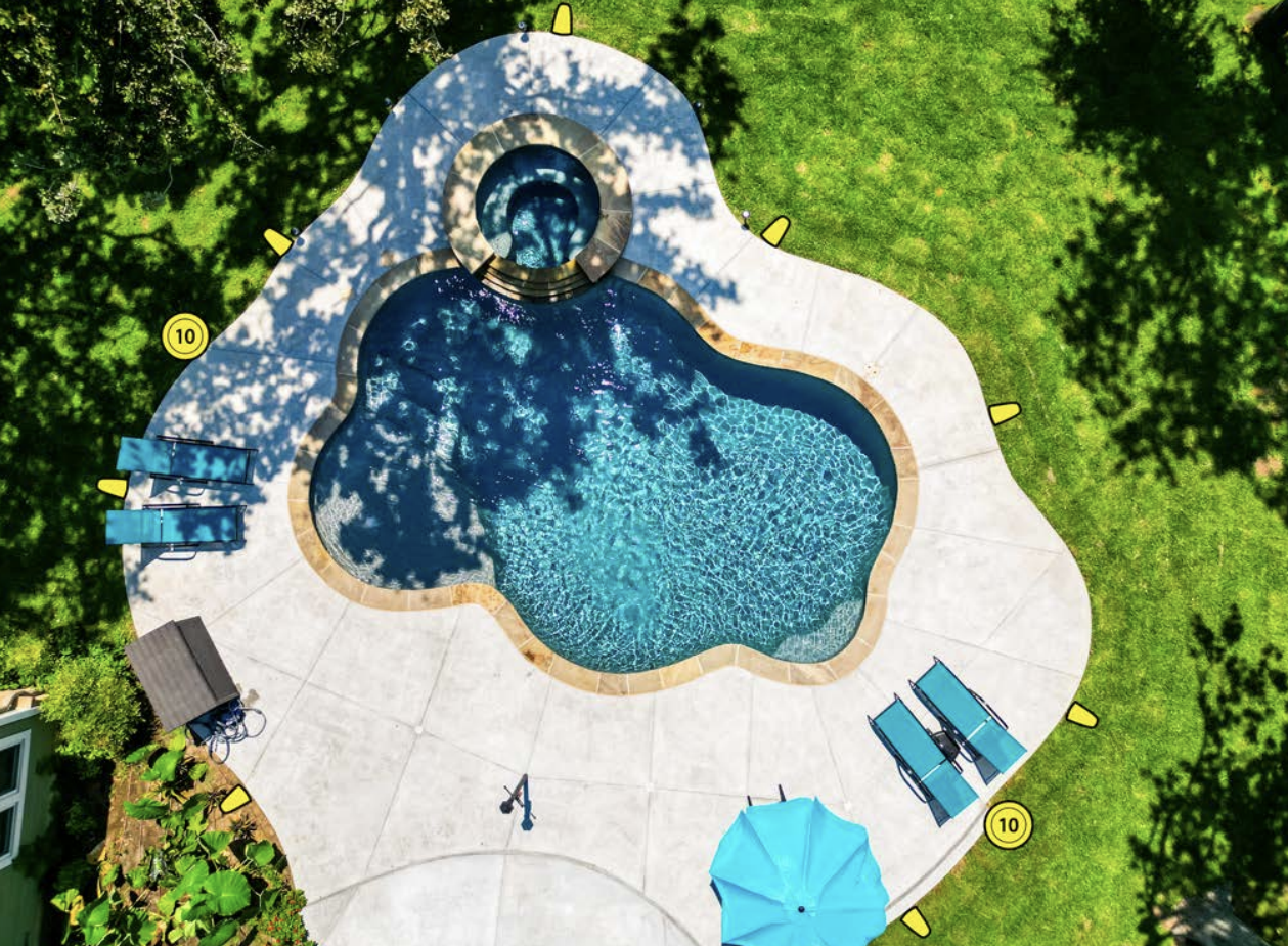 Aerial view of a custom pool with a kid-friendly pool design.